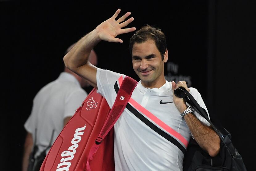 Switzerland's Roger Federer gestures after South Korea's Chung Hyeon retired from their...