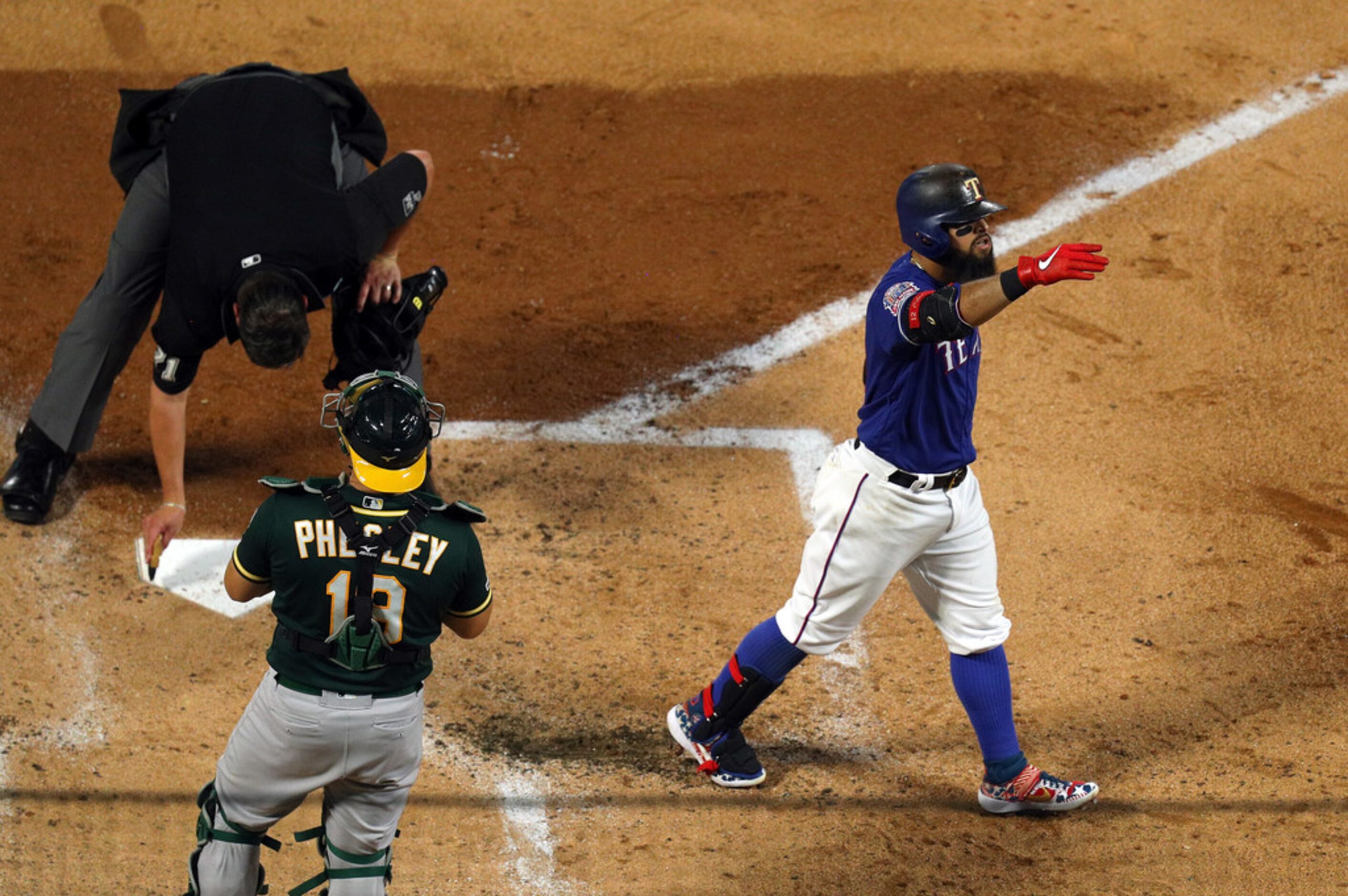 ARLINGTON, TEXAS - SEPTEMBER 14: Rougned Odor #12 of the Texas Rangers gestures after his...