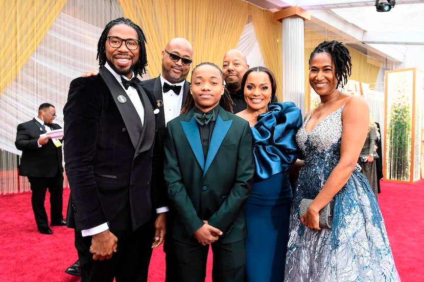 Texas teen Deandre Arnold (C) poses with Karen Rupert (R) and  filmmakers of "Hair Love" as...