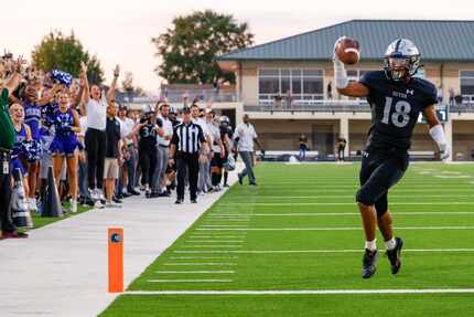 Denton Guyer defensive back Eli Bowen (18) crosses the goal line for a touchdown after...