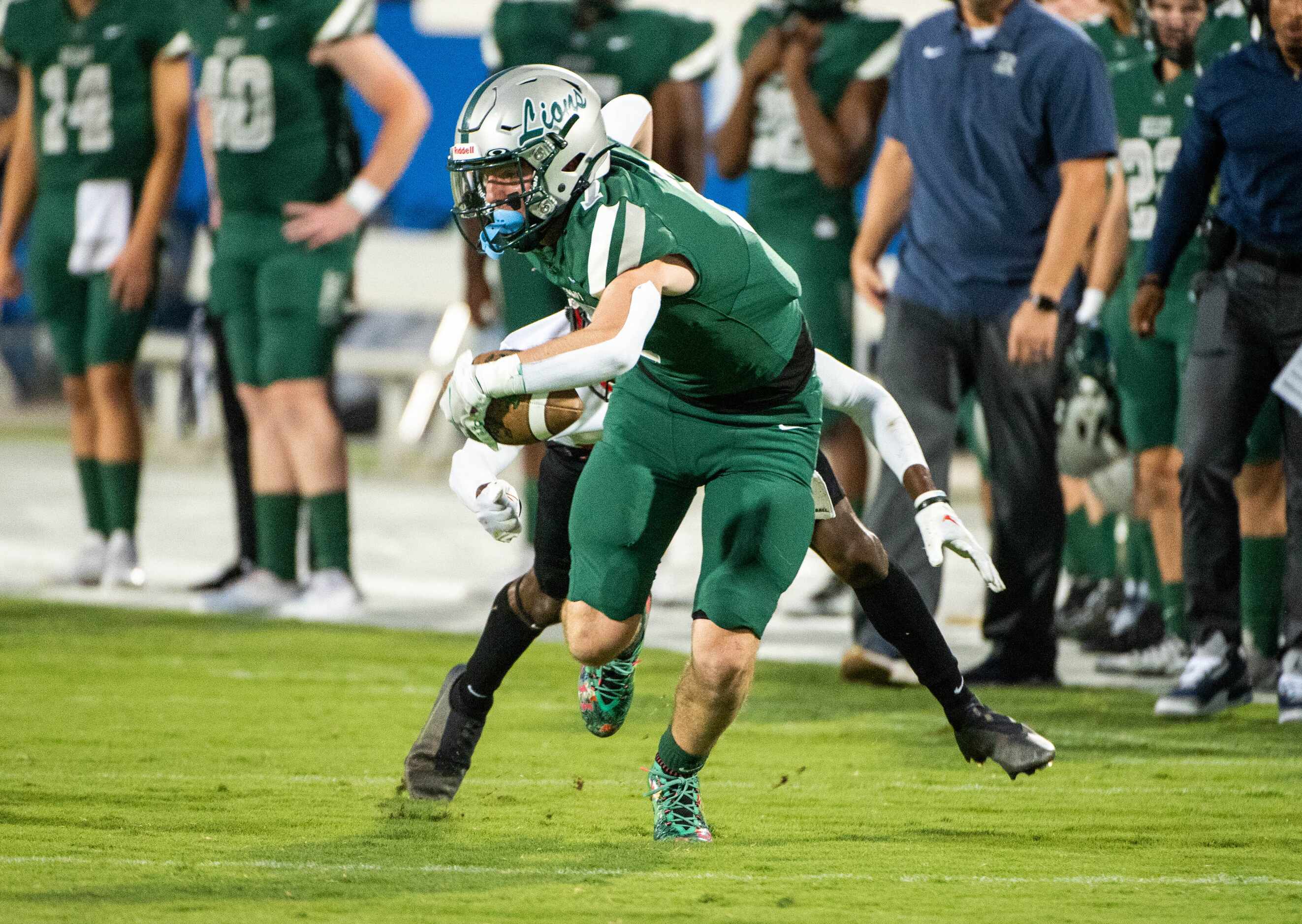 Frisco Reedy's  AJ Jayroe (7) runs past a tackle attempt by Frisco Liberty's Jon Jessop (12)...