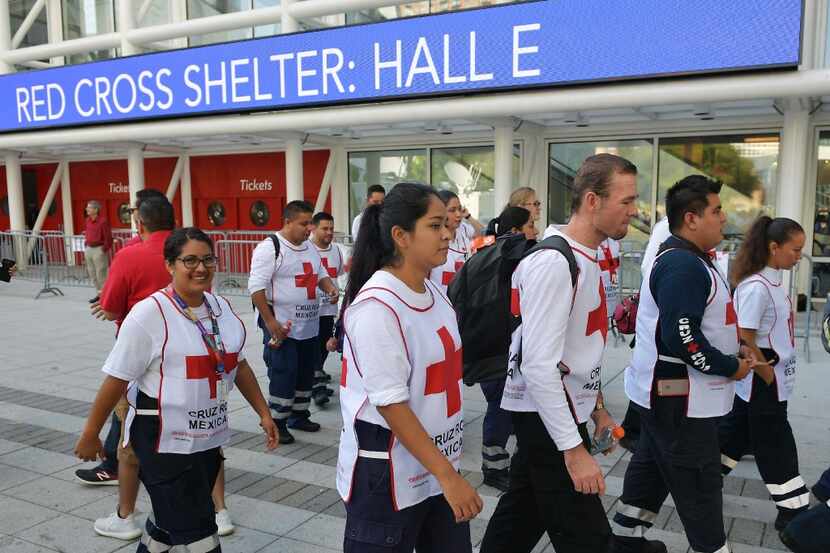 Red Cross workers from Mexico arrive at the George R. Brown Convention Center which has been...
