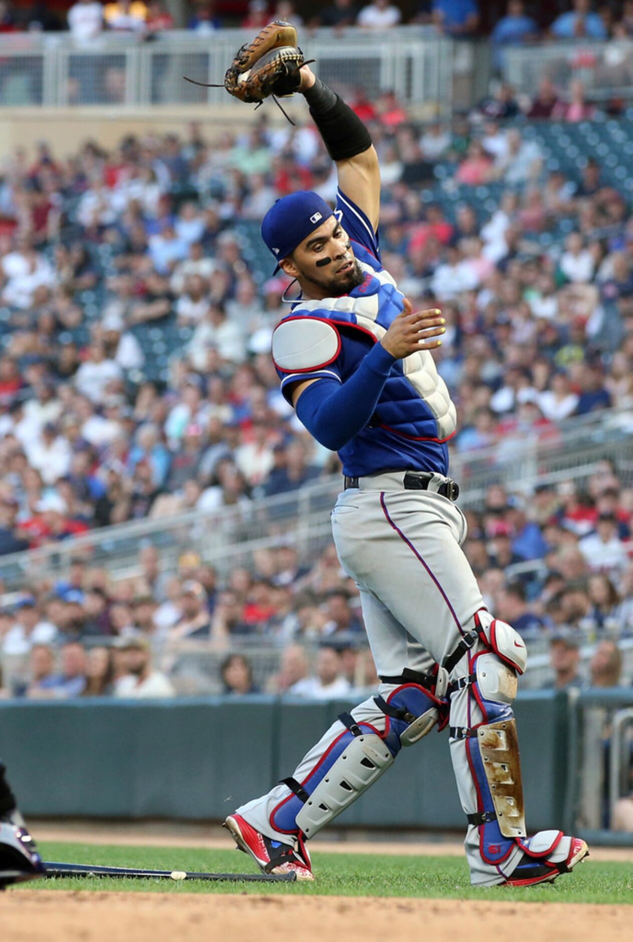 Texas Rangers catcher Robinson Chirinos catches a pop foul by Minnesota Twins' Brian Dozier...