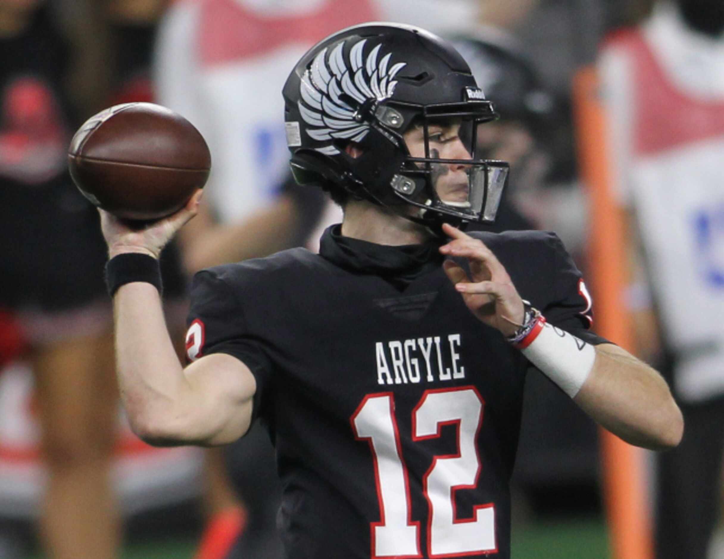 Argyle quarterback CJ Rogers (12) prepares to launch a pass across the middle into the...