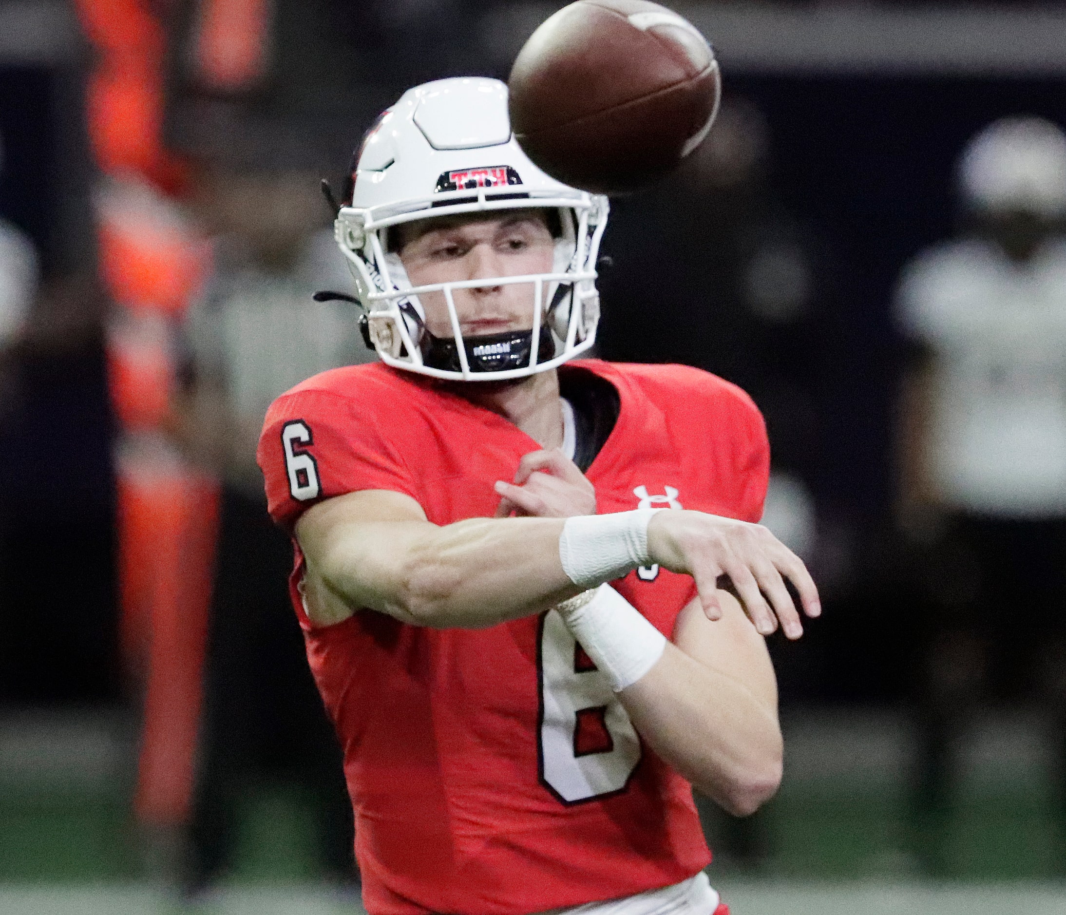 Melissa High School quarterback Trever Ham (6) throws a pass during the first half as...