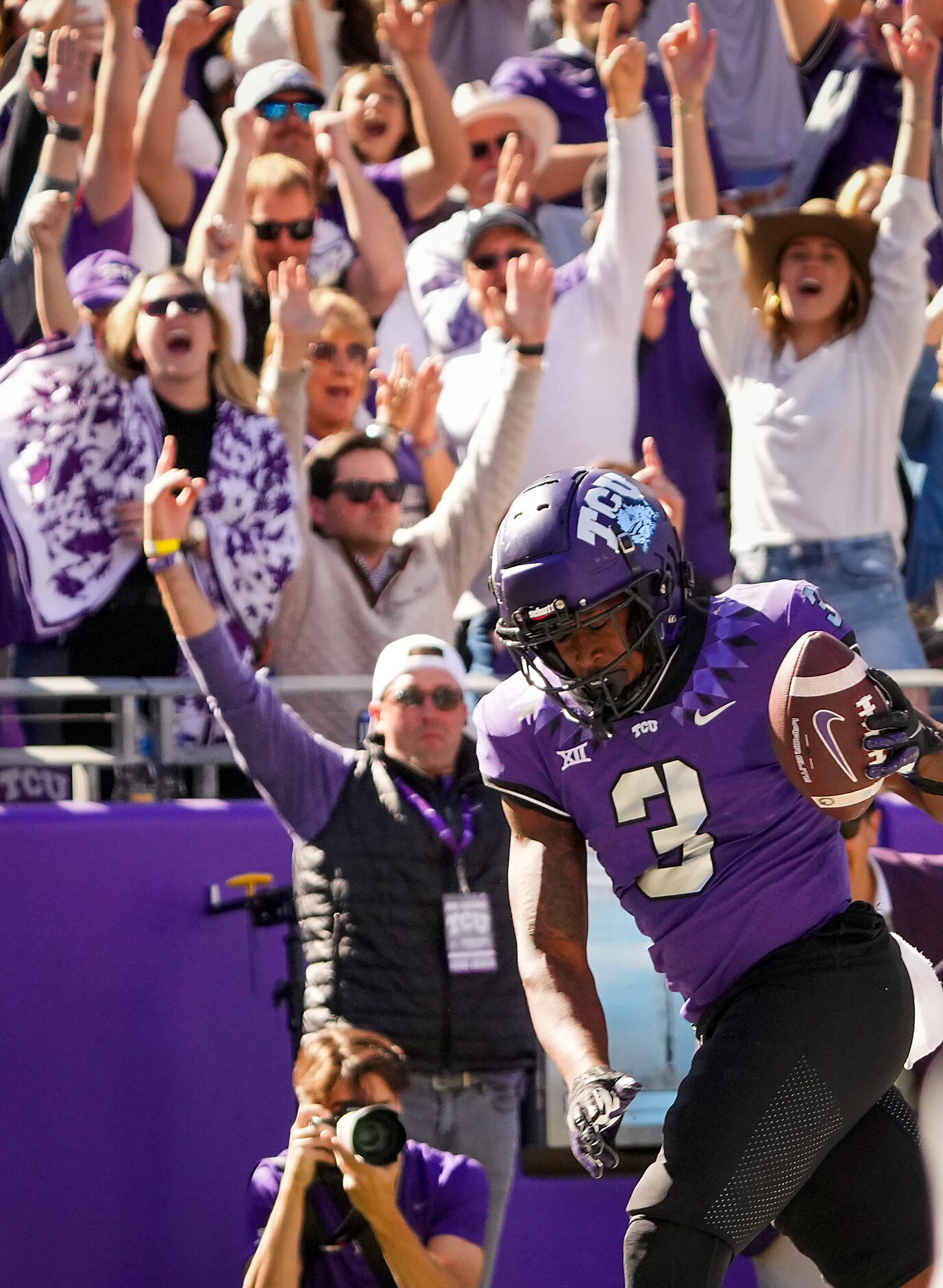 TCU running back Emari Demercado (3) scores  on a touchdown reception during the second half...