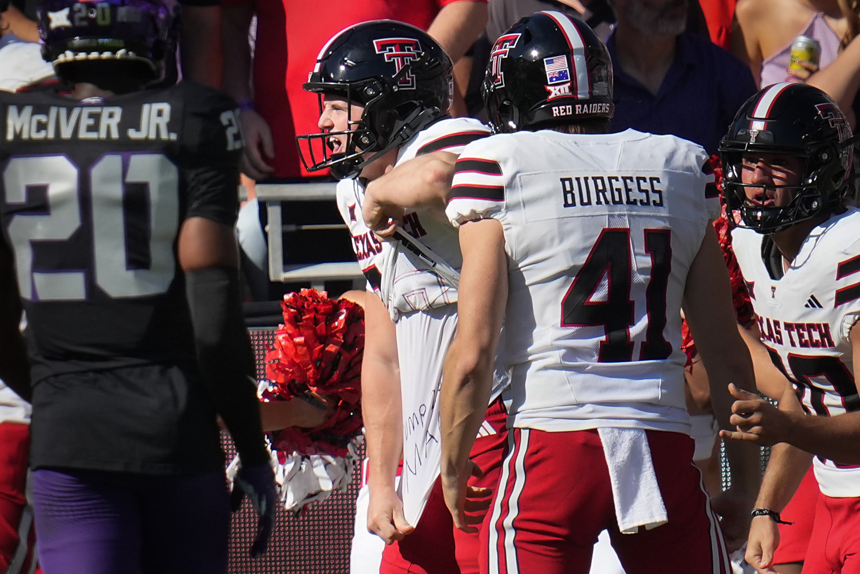 Texas Tech place kicker Reese Burkhardt pulls up his jersey to display a pro-Trump message...