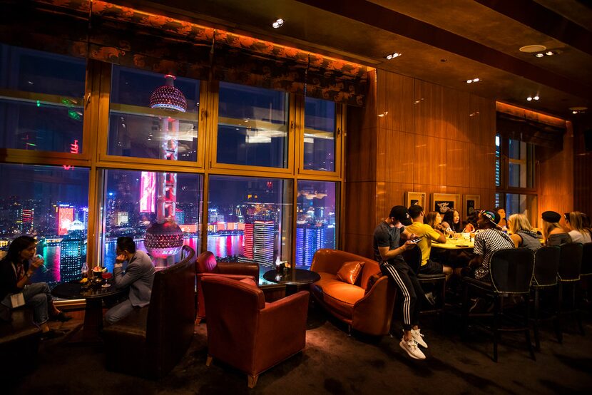 Members of the Philadelphia 76ers dance team (right) take in the view from the top floor bar...