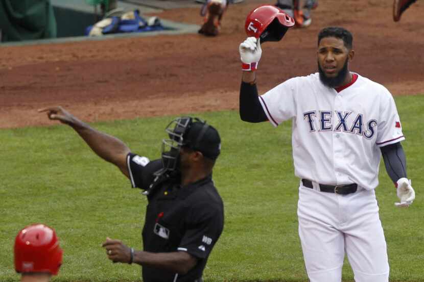 Texas Rangers shortstop Elvis Andrus (1) is thrown out of the game in the fourth inning in...