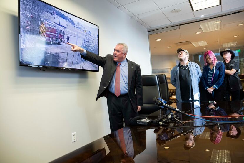 (From left) Attorney George Milner III shows the video of the incident as Kyle Vess the...