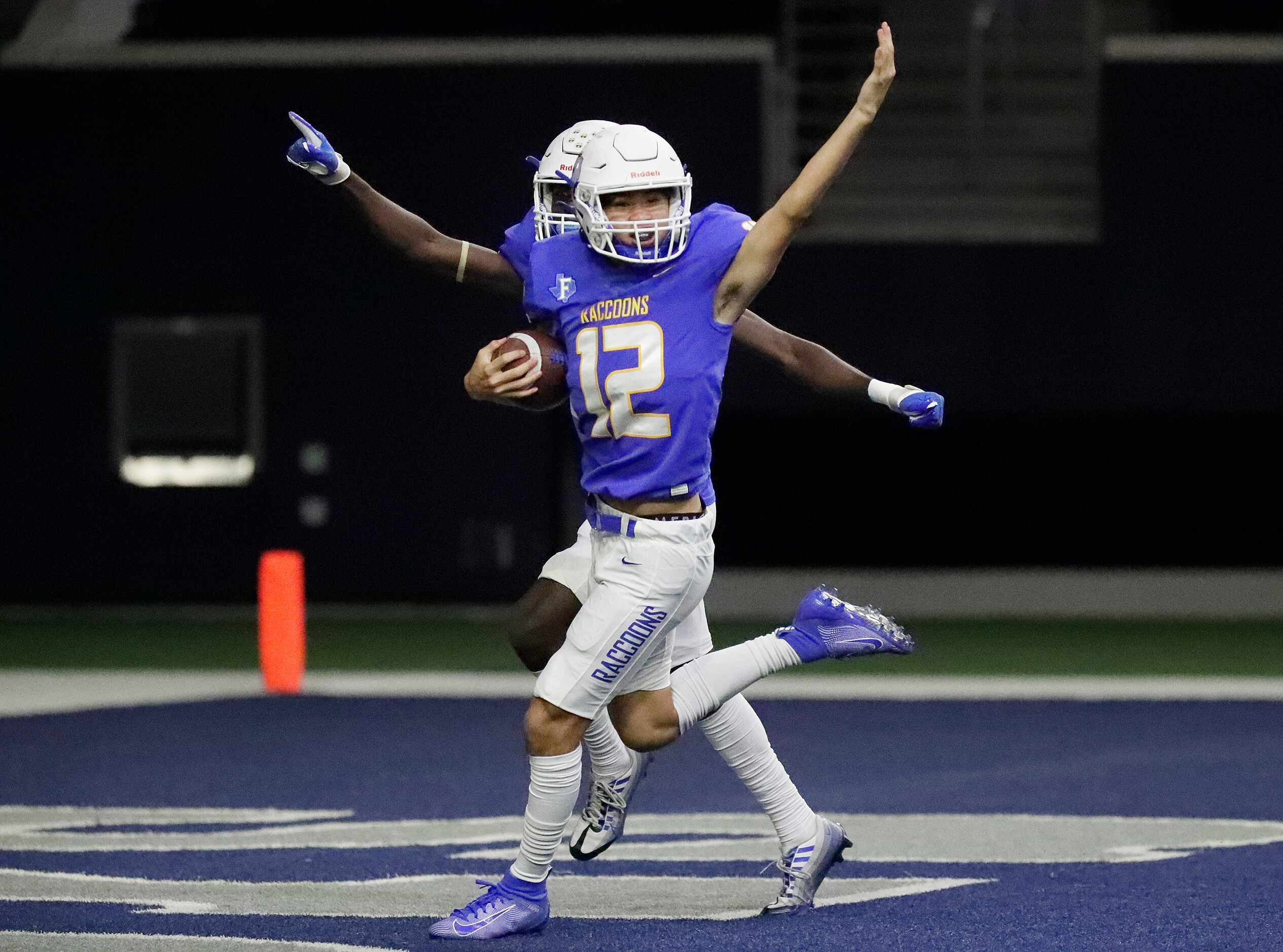 Frisco High School defender Evan Nguyen (12) scoops up a fumble on a punt return and is...