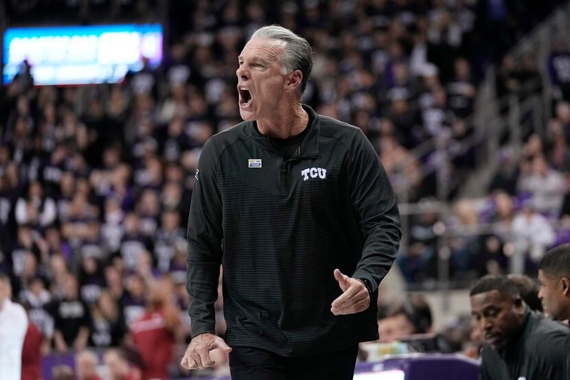 TCU coach Jamie Dixon shouts to players during the first half of the team's NCAA college...