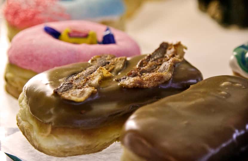 Voodoo Dougnut's bacon maple bar is one of its most popular items. The shop also sells kooky...