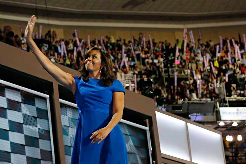 First Lady Michelle Obama waves as she leaves the stage during the Democratic National...