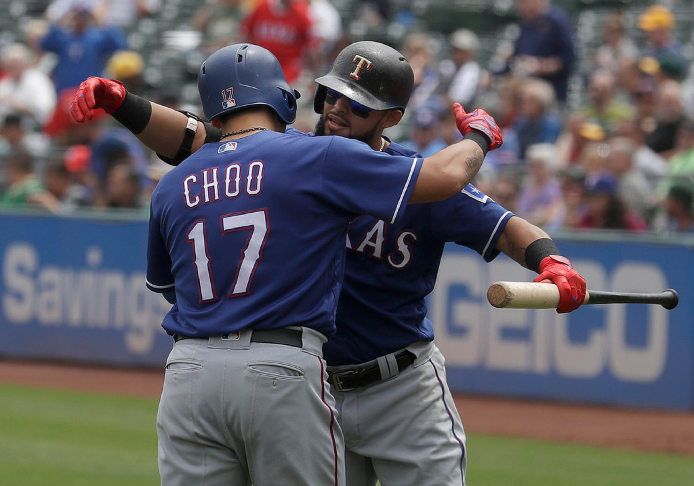 Texas Rangers' Shin-Soo Choo (17) is congratulated by Rougned Odor after hitting a solo home...