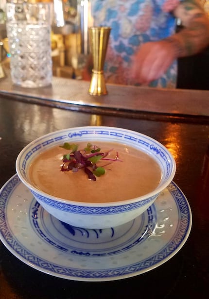 In Uptown, Bowen House's Do, Re, Miso cocktail, served in a small bowl, supplemented...