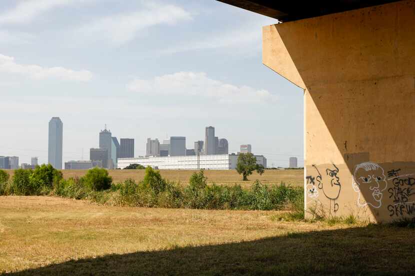 A DART light rail bridge is seen near the Trinity River and downtown Dallas on Thursday.