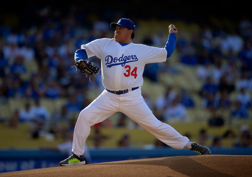 FILE - Fernando Valenzuela throws to the plate during the Old-Timers baseball game, June 8,...