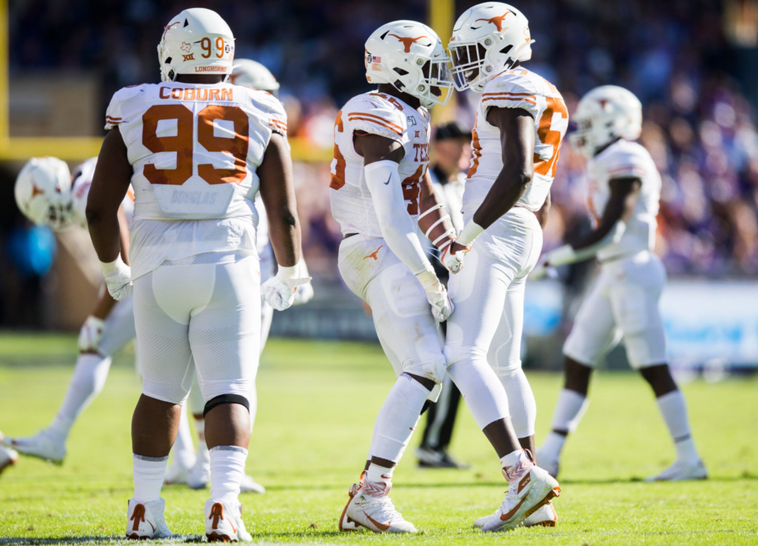 Texas Longhorns linebacker Joseph Ossai (46) and defensive lineman D'Andre Christmas-Giles...