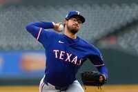 Texas Rangers pitcher Dane Dunning throws against the Detroit Tigers in the first inning of...