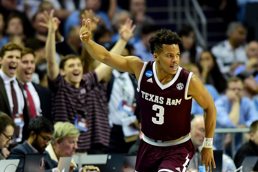 CHARLOTTE, NC - MARCH 18:  Admon Gilder #3 of the Texas A&M Aggies reacts after a three...