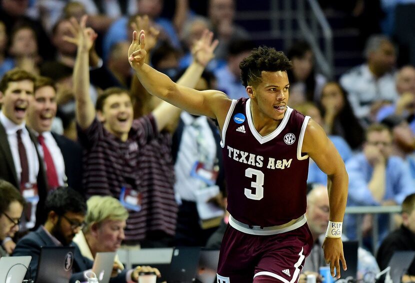 CHARLOTTE, NC - MARCH 18:  Admon Gilder #3 of the Texas A&M Aggies reacts after a three...