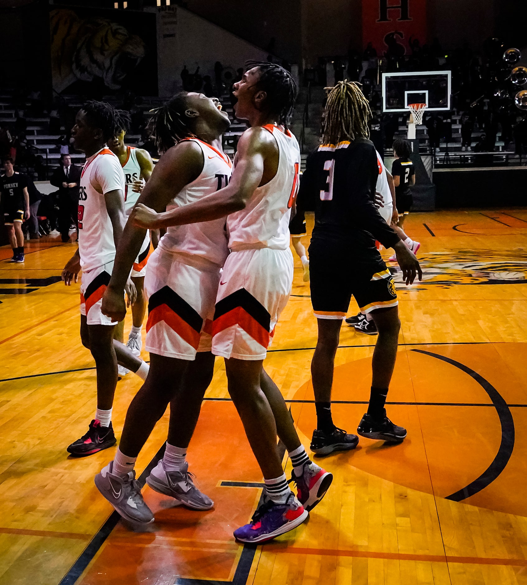 Lancaster's Kade Douglas (0) celebrates with Mario Perry (5) after a victory over Forney in...