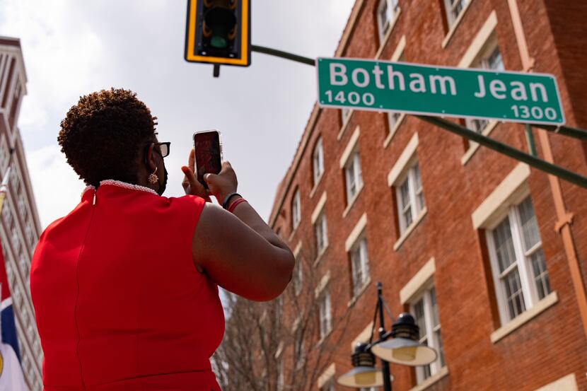 Botham Jean's mother, Allison Jean, took a photo of a sign bearing his name at a ceremony to...