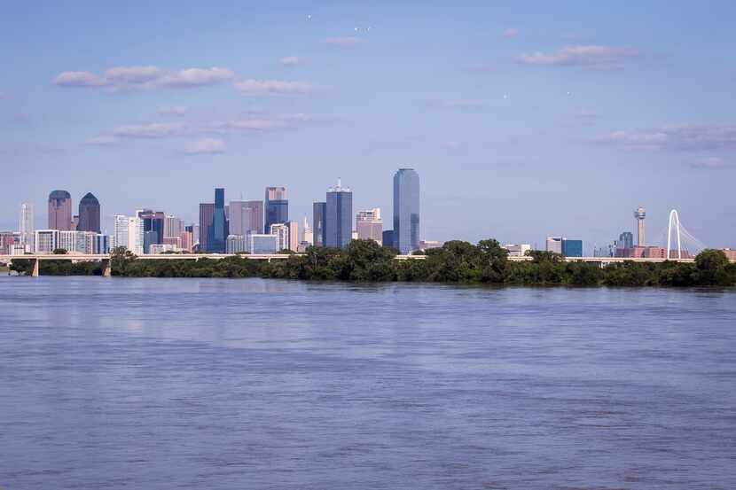 The Dallas skyline is seen above the flooded Trinity River in May.
