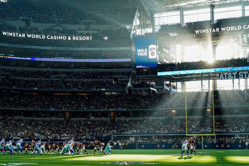 Sunlight steams through the windows of the stadium during the first half of an NFL football...