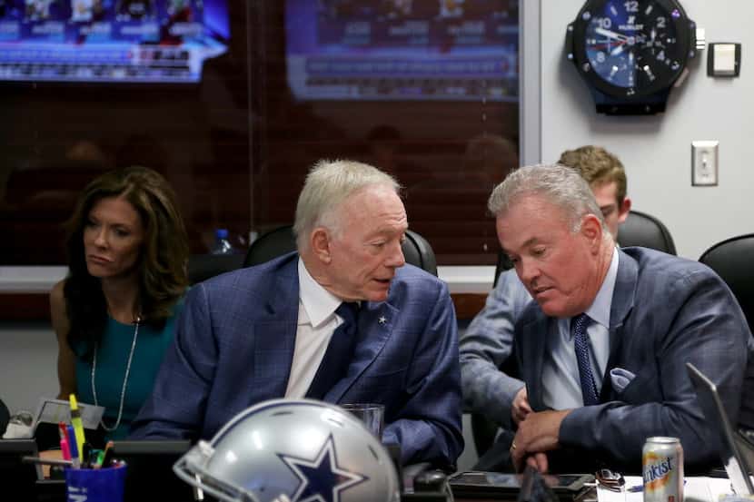 Dallas Cowboys owner Jerry Jones and Executive Vice President/COO Stephen Jones talk in the...