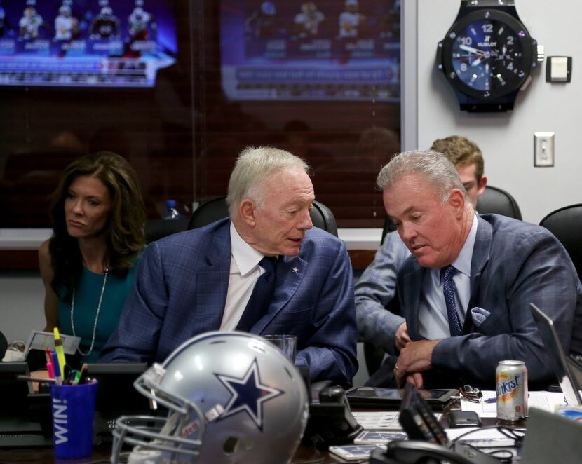 Dallas Cowboys owner Jerry Jones and Executive Vice President/COO Stephen Jones talk in the...