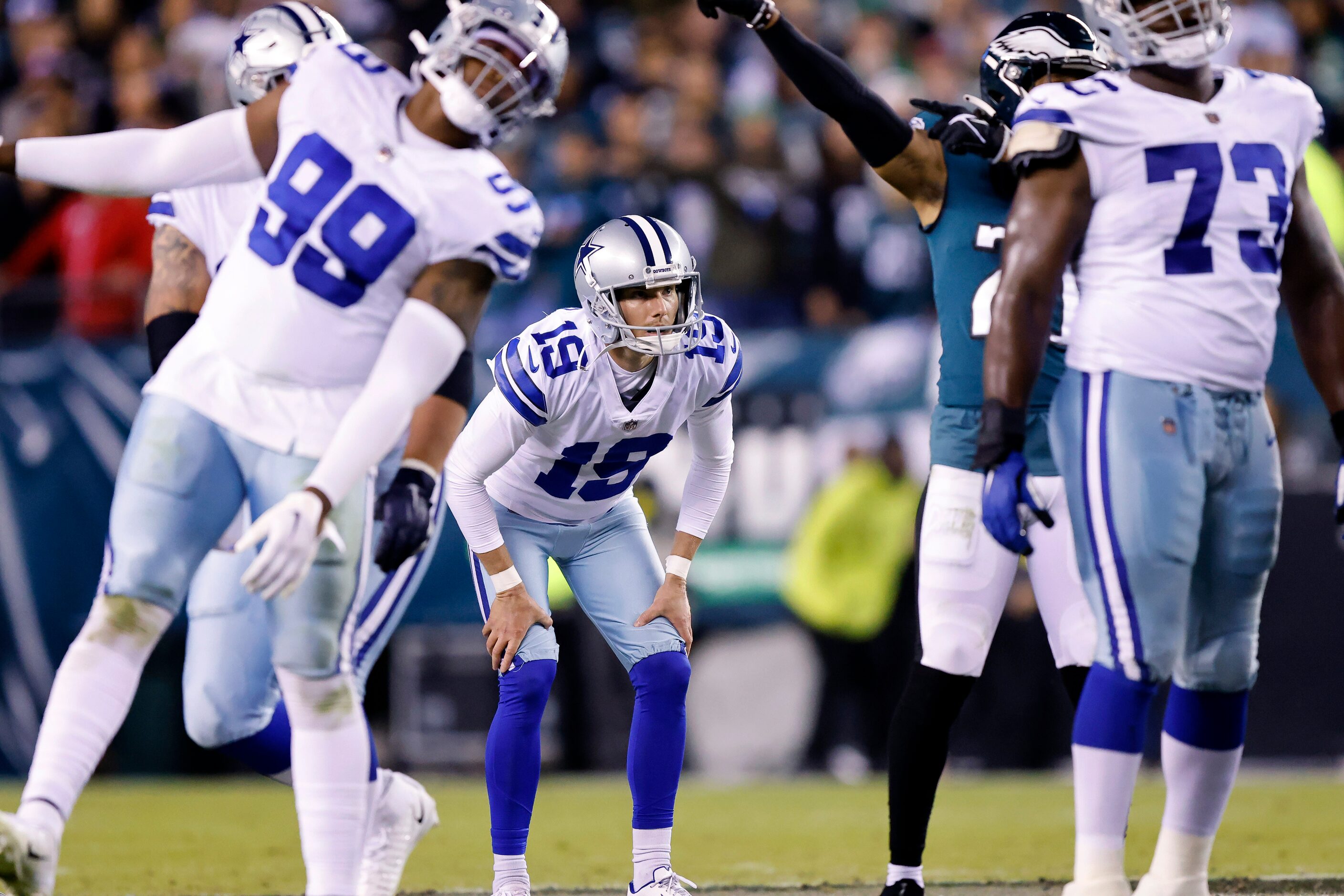 Dallas Cowboys place kicker Brett Maher (19) looks between players as he misses his fourth...