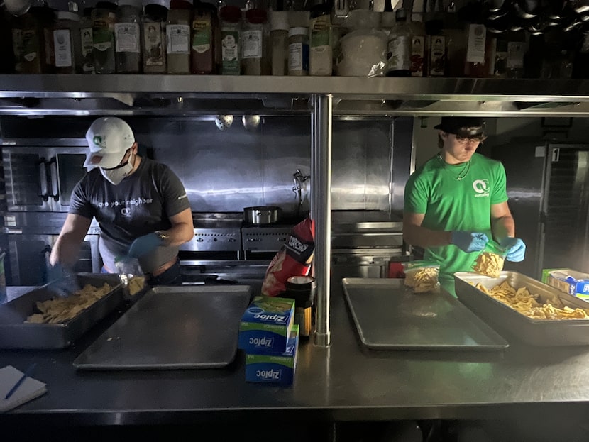 OurCalling volunteer Reuben Gregorian (left) and staff member Logan Walker prep 200 bags of...