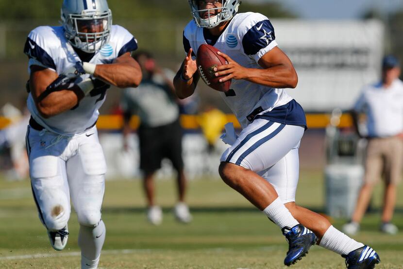 Dallas Cowboys quarterback Dak Prescott (4) drops back to pass during afternoon practice at...