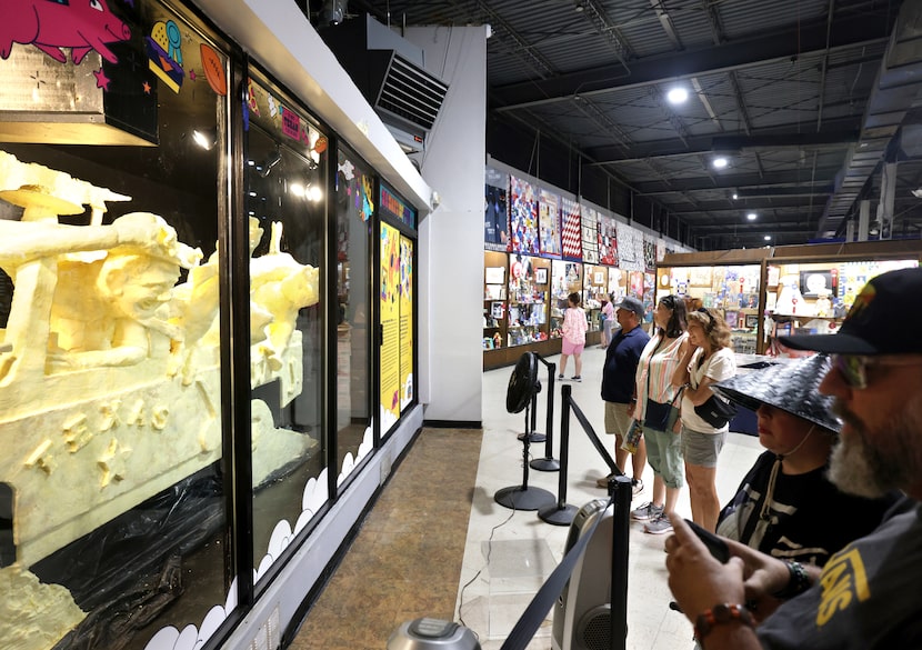 Visitors look at the butter sculpture at the State Fair of Texas in Dallas, TX, on Sep 30,...