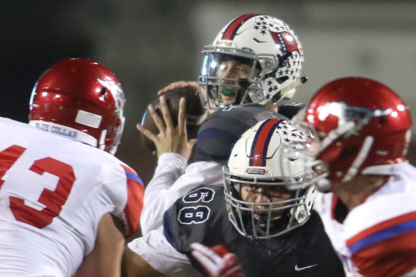 Richland quarterback Trae Self (1) looks to pass downfield during first half action against...