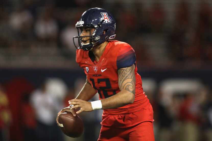 TUCSON, AZ - OCTOBER 29:  Quarterback Anu Solomon #12 of the Arizona Wildcats looks to pass...