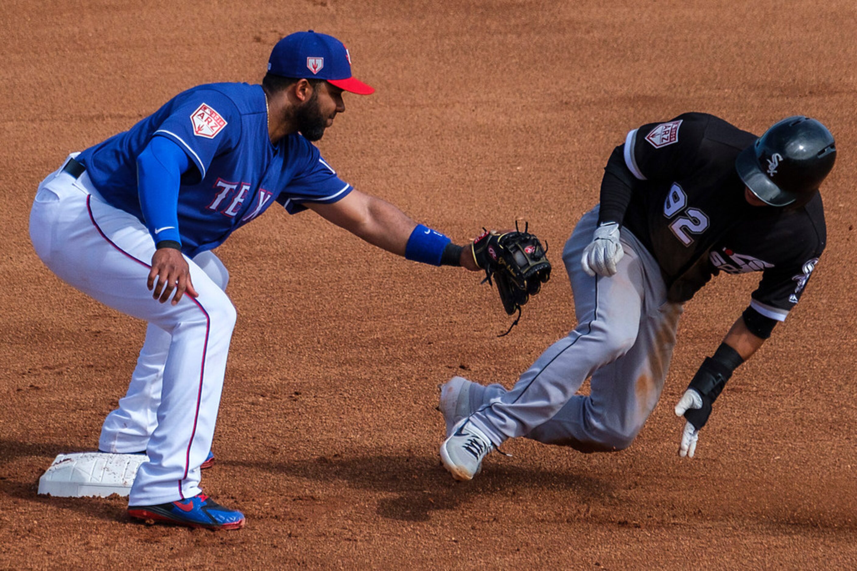 Chicago White Sox second baseman Nick Madrigal is caught stealing as Texas Rangers shortstop...