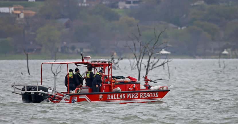 Crews from Dallas Fire-Rescue search for a fisherman at Lake Ray Hubbard on Friday in...