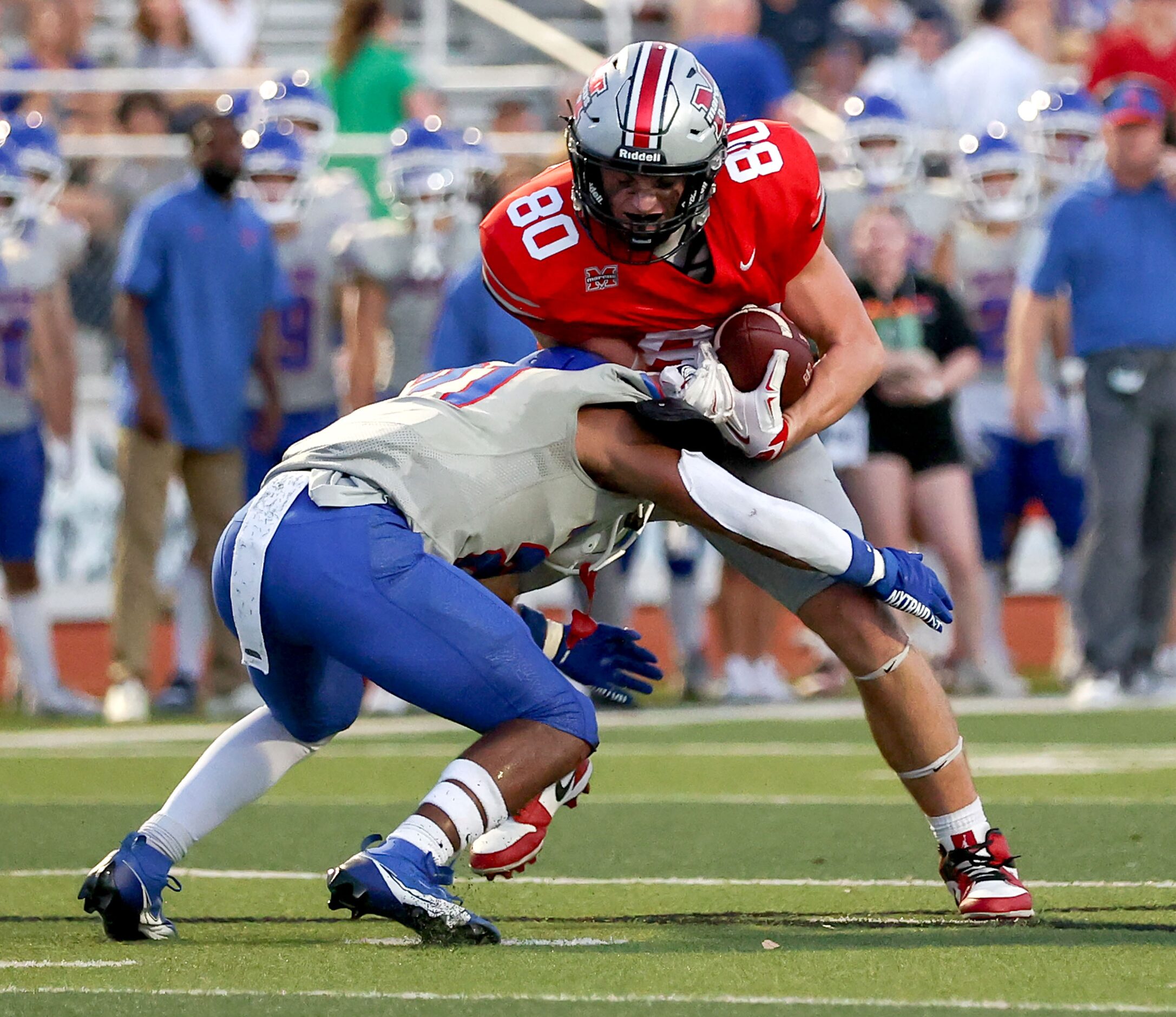 Flower Mound Marcus tight end Jackson Morris comes up with a reception as he is stopped by...