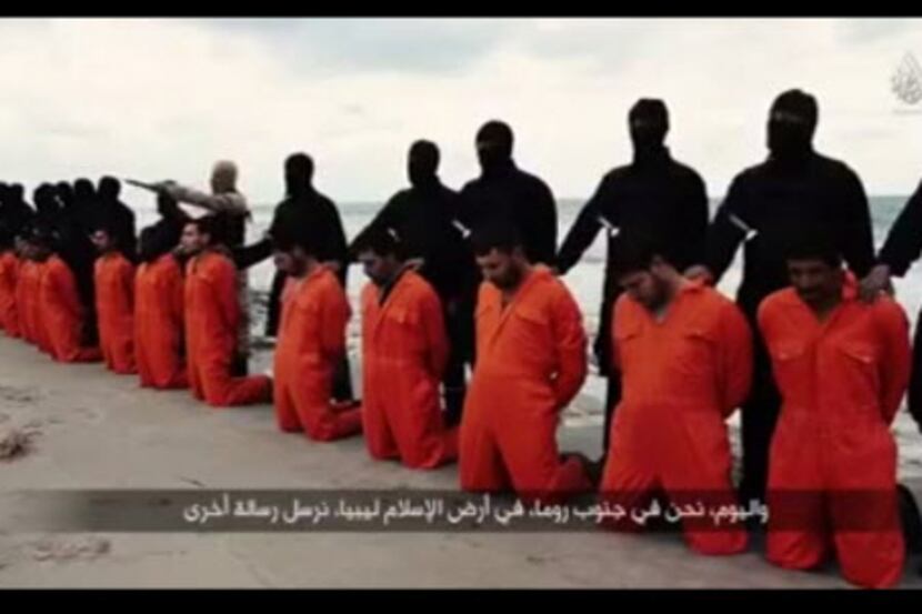 
An image grab from a video published on YouTube on Sunday shows black-clad Islamic State...