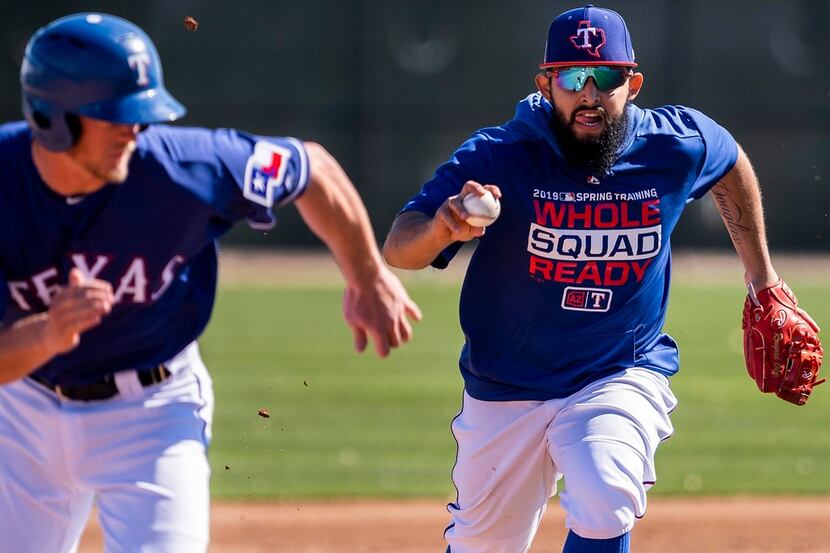Texas Rangers second baseman Rougned Odor chases down minor leaguer Alex Kowalczyk in a...