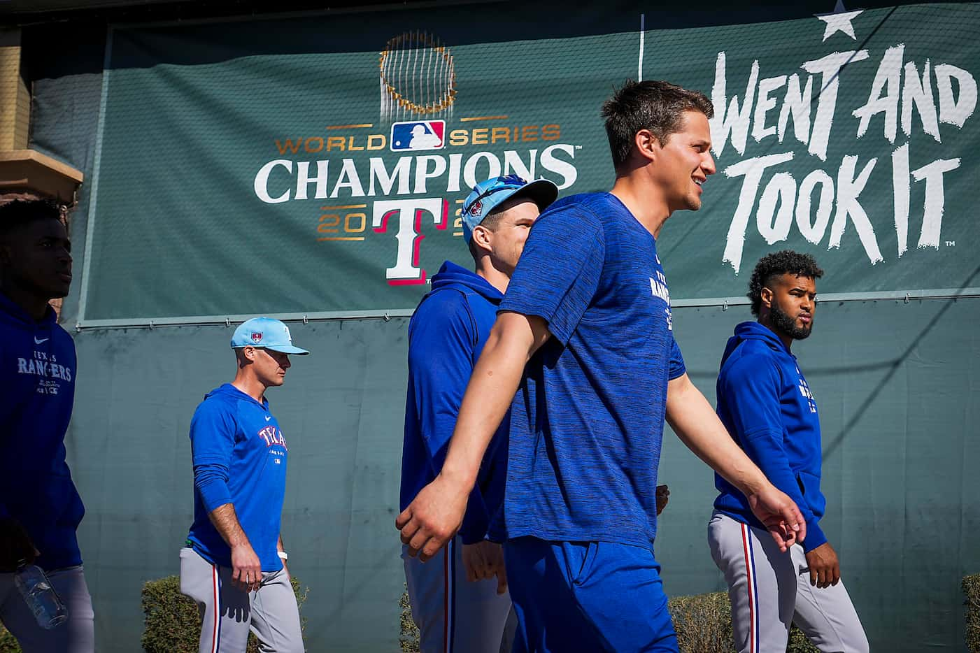 Texas Rangers infielder Corey Seager passes a banner commemorating the Rangers 2023 World...