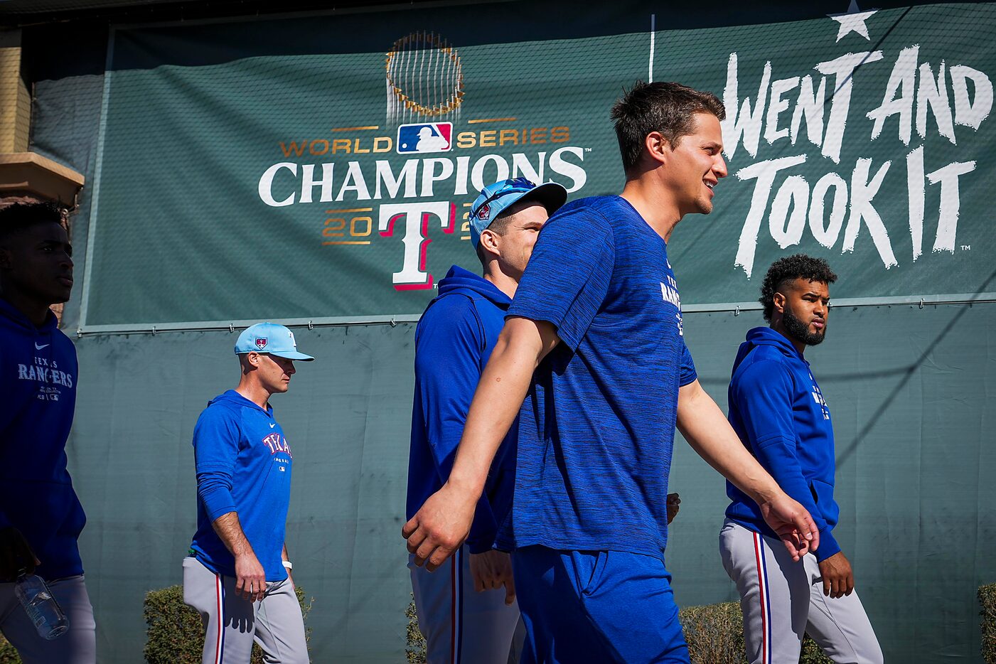 Texas Rangers infielder Corey Seager passes a banner commemorating the Rangers 2023 World...