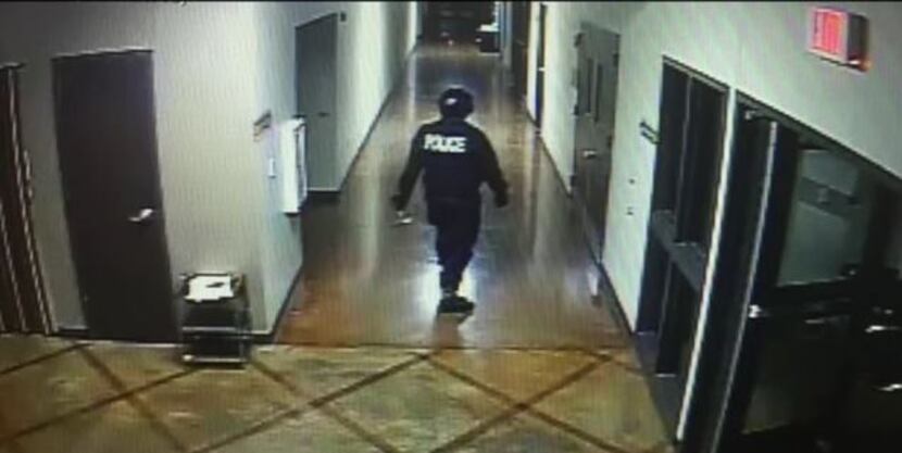 A screen shot from surveillance footage shows the suspect inside Creekside Church of Christ.