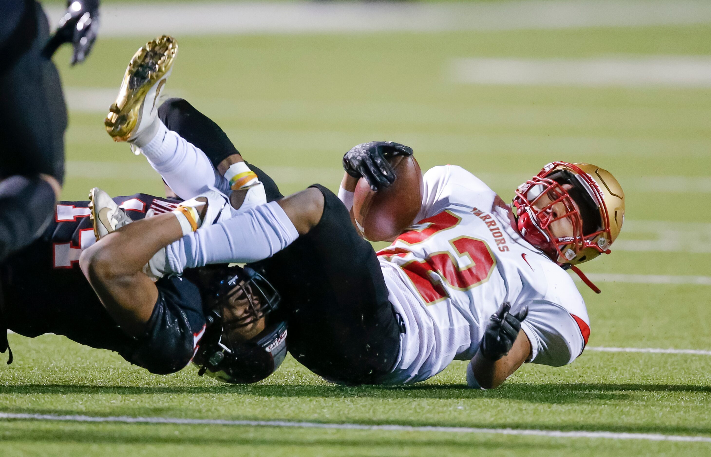 Lake Highlands senior defensive back Tobias Henry (14) tackles South Grand Prairie sophomore...