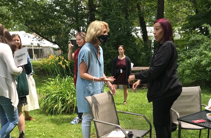 Pamela Tatge, director of Jacob's Pillow Dance Festival (center, in mask), greeted Melissa...