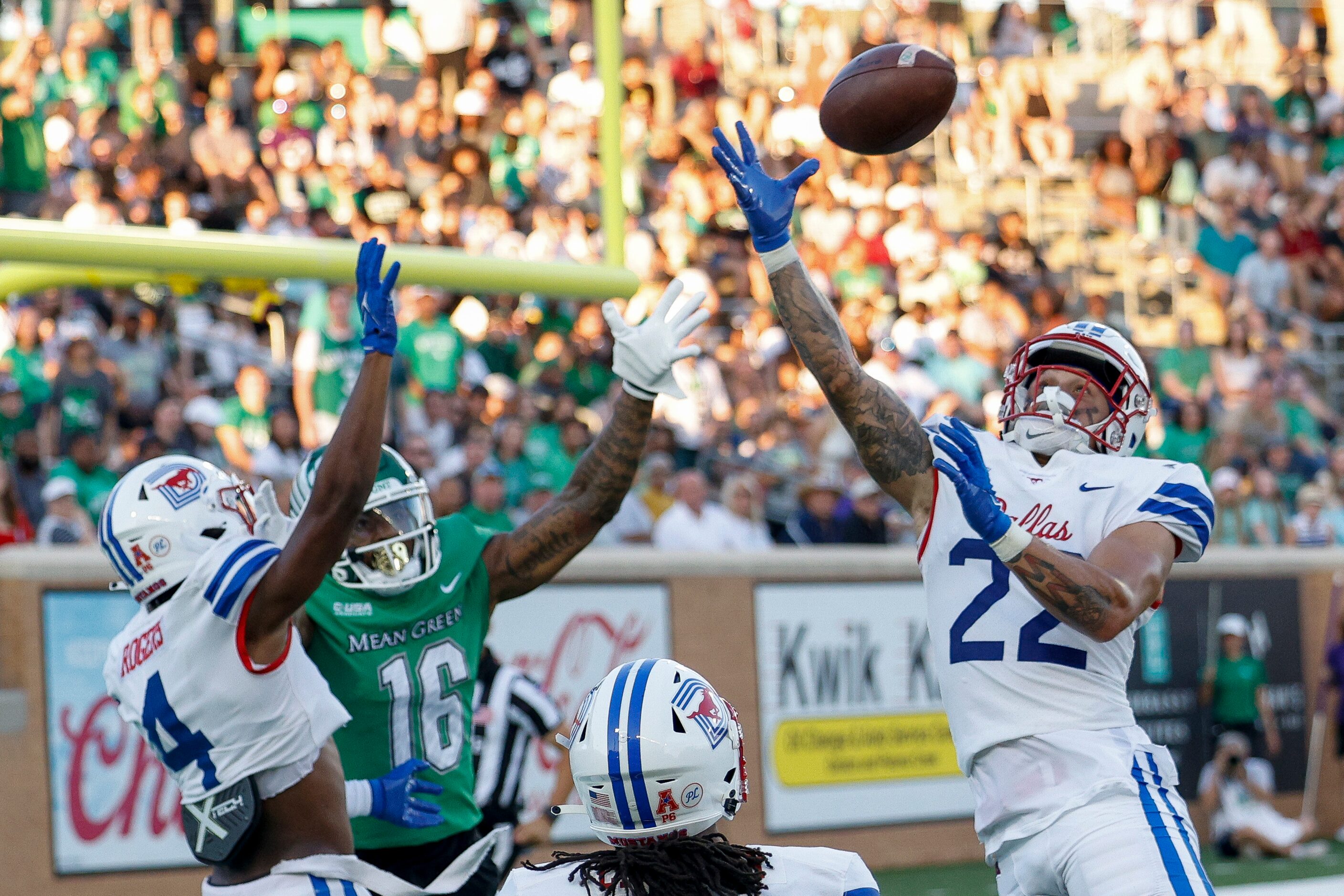 SMU safety Nick Roberts (22) breaks up a pass intended for UNT wide receiver Jyaire Shorter...