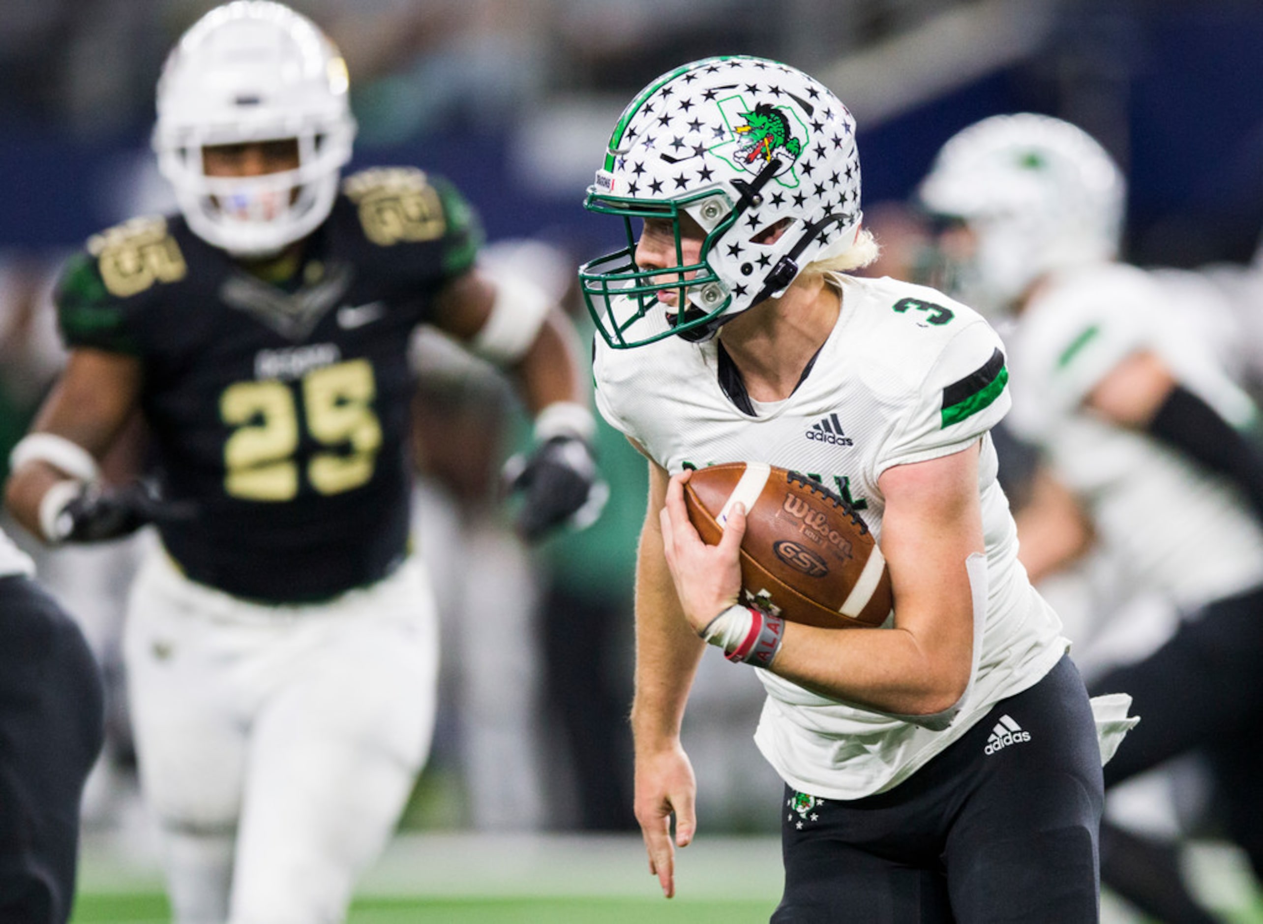 Southlake Carroll quarterback Quinn Ewers (3) runs the ball during the fourth quarter of a...